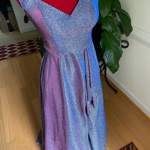 A purple and pink shimmery floor length gown.